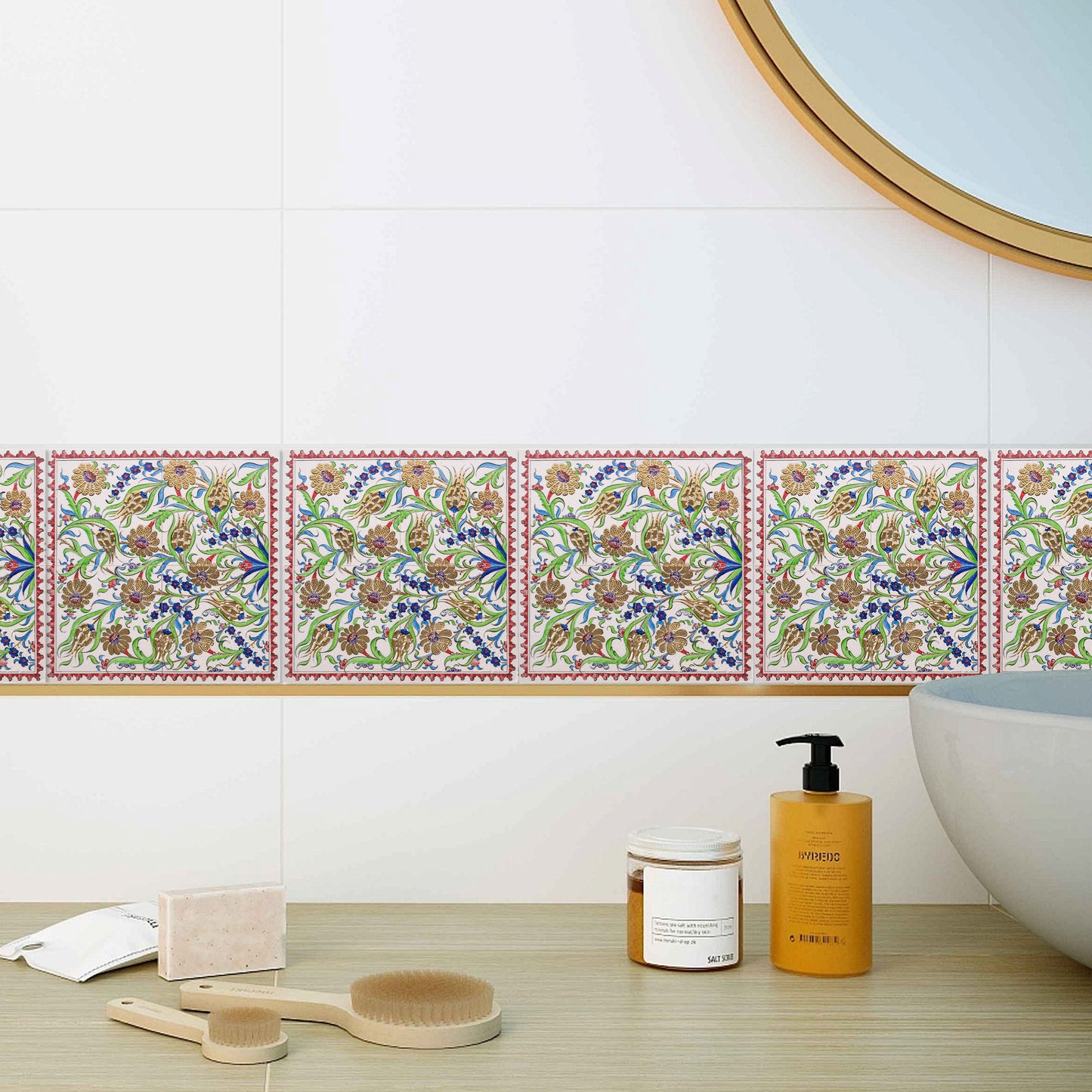 Decorative ceramic tiles with floral patterns on a bathroom wall.