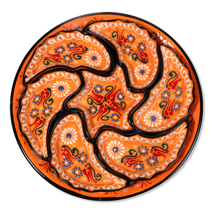 Decorative snack serving tray set with intricate patterns on an orange background