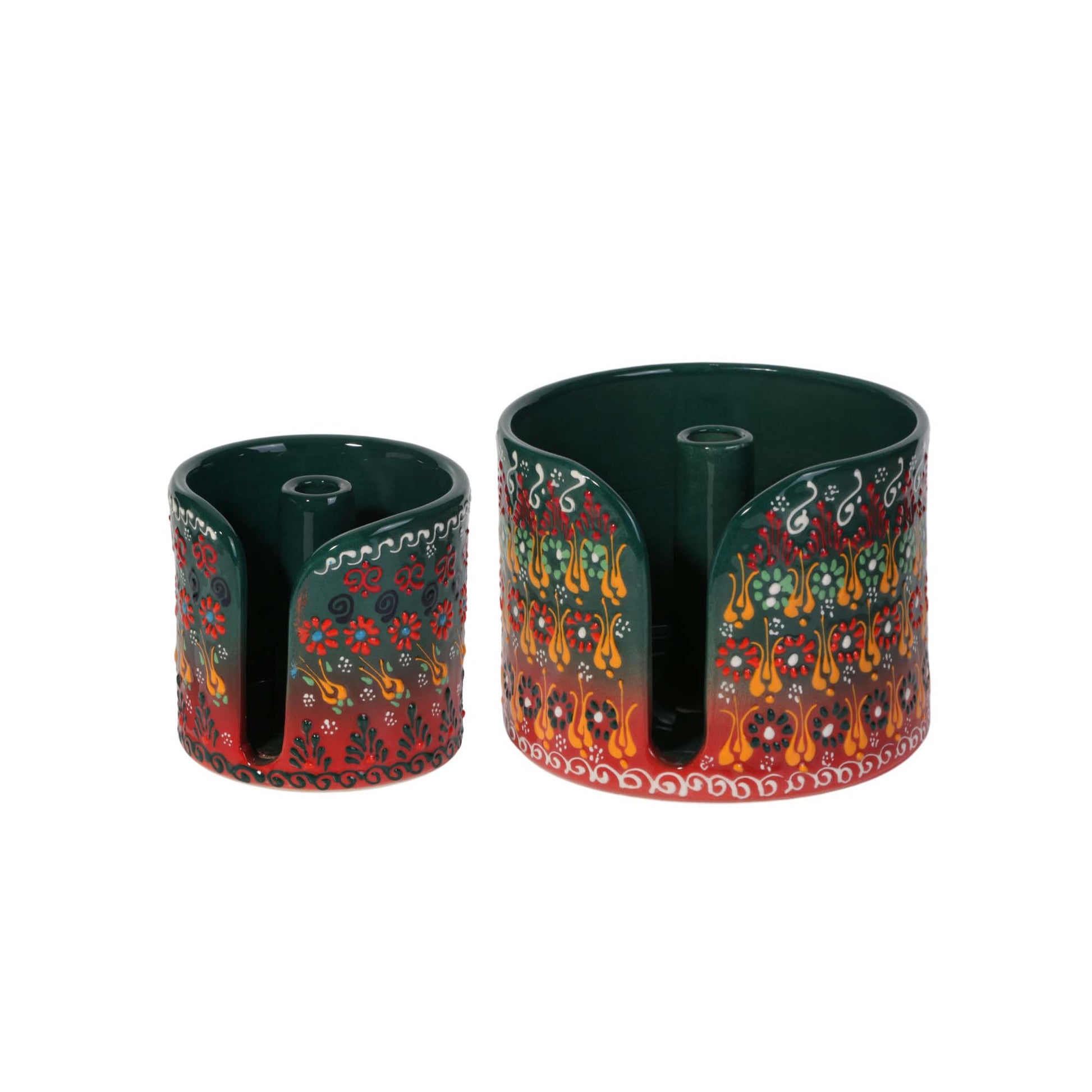 Two decorative paper towel holders with floral patterns on a white background