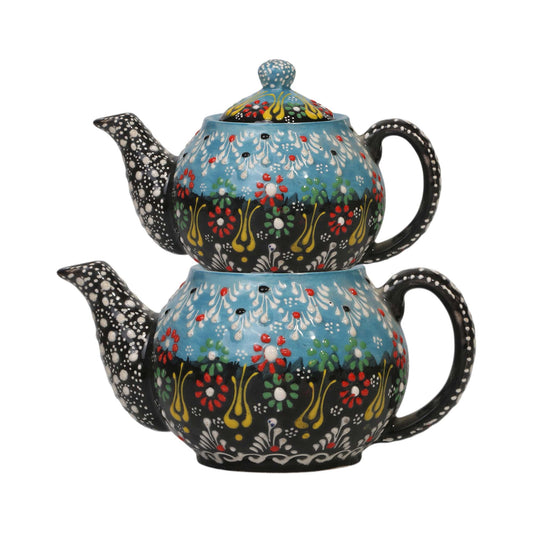 Decorative teapot with floral patterns on a white background