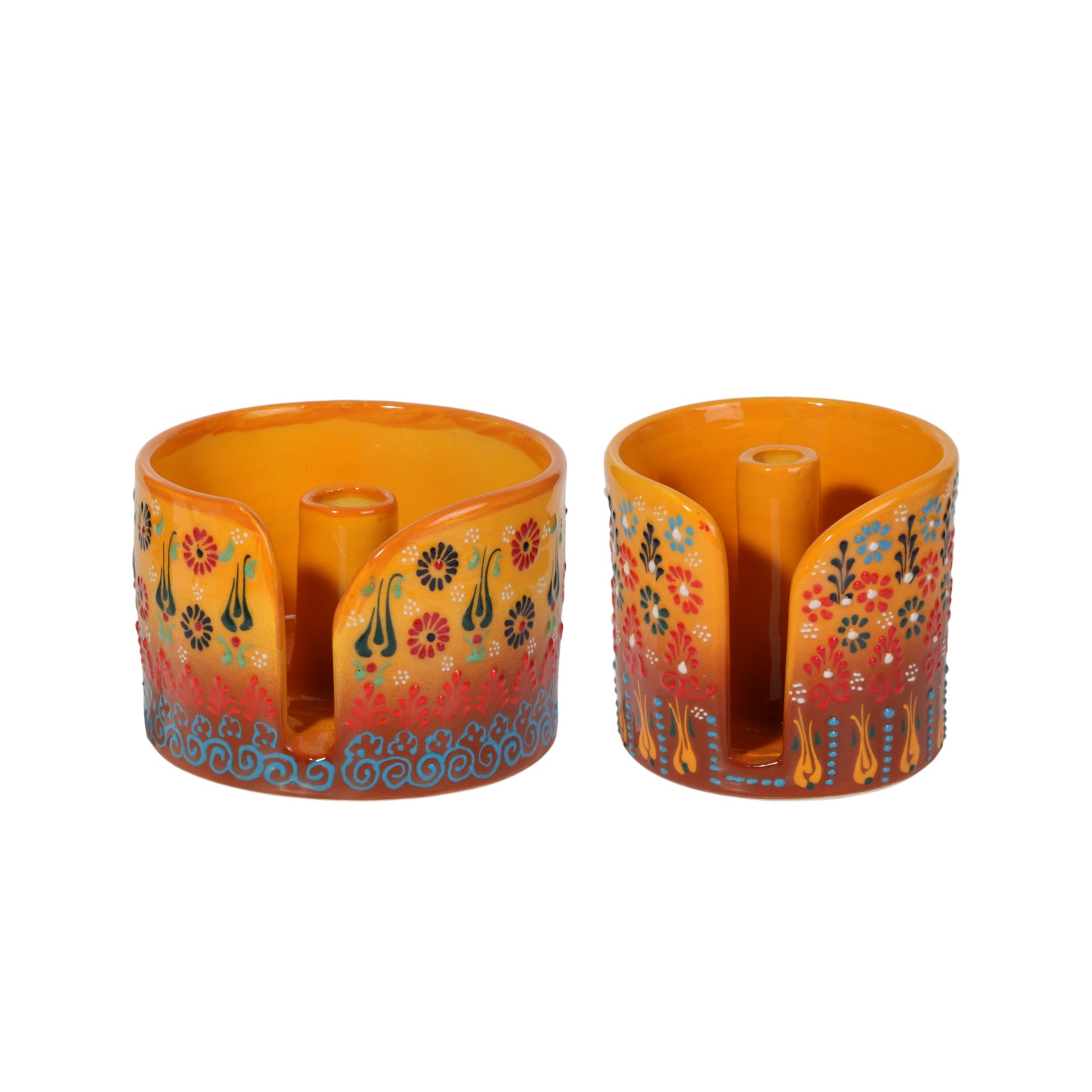 Two colorful ceramic paper towel holder with floral designs on a white background