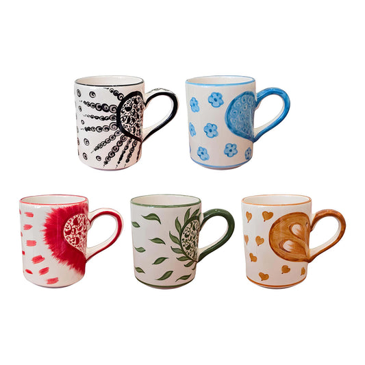 Set of six patterned mugs on a white background
