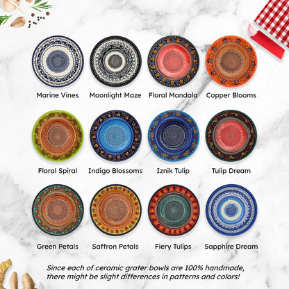 Collection of ceramic garlic grater bowls with various patterns on a marble surface.