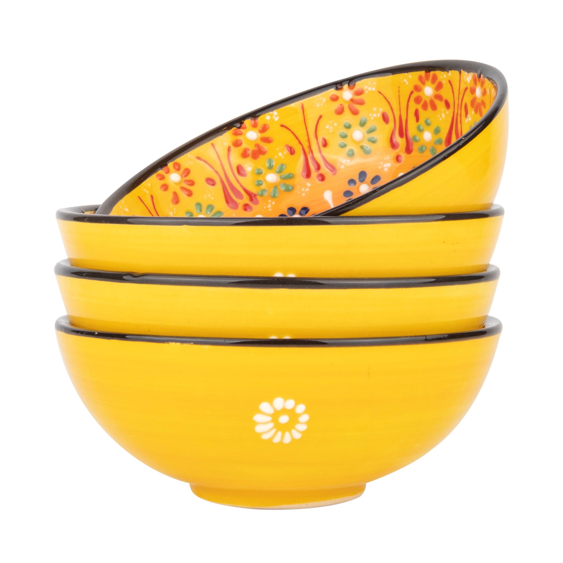 Set of yellow ceramic serving bowls with floral patterns on a white background