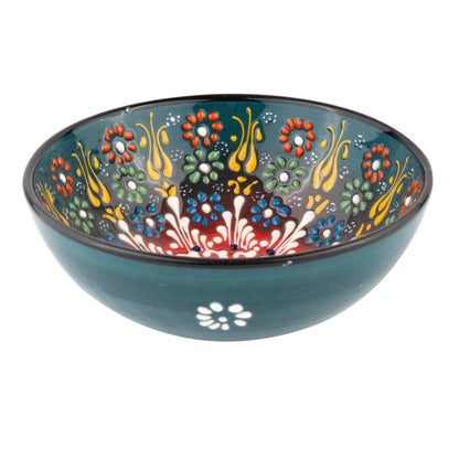 Decorative ceramic serving bowl with floral patterns on a white background