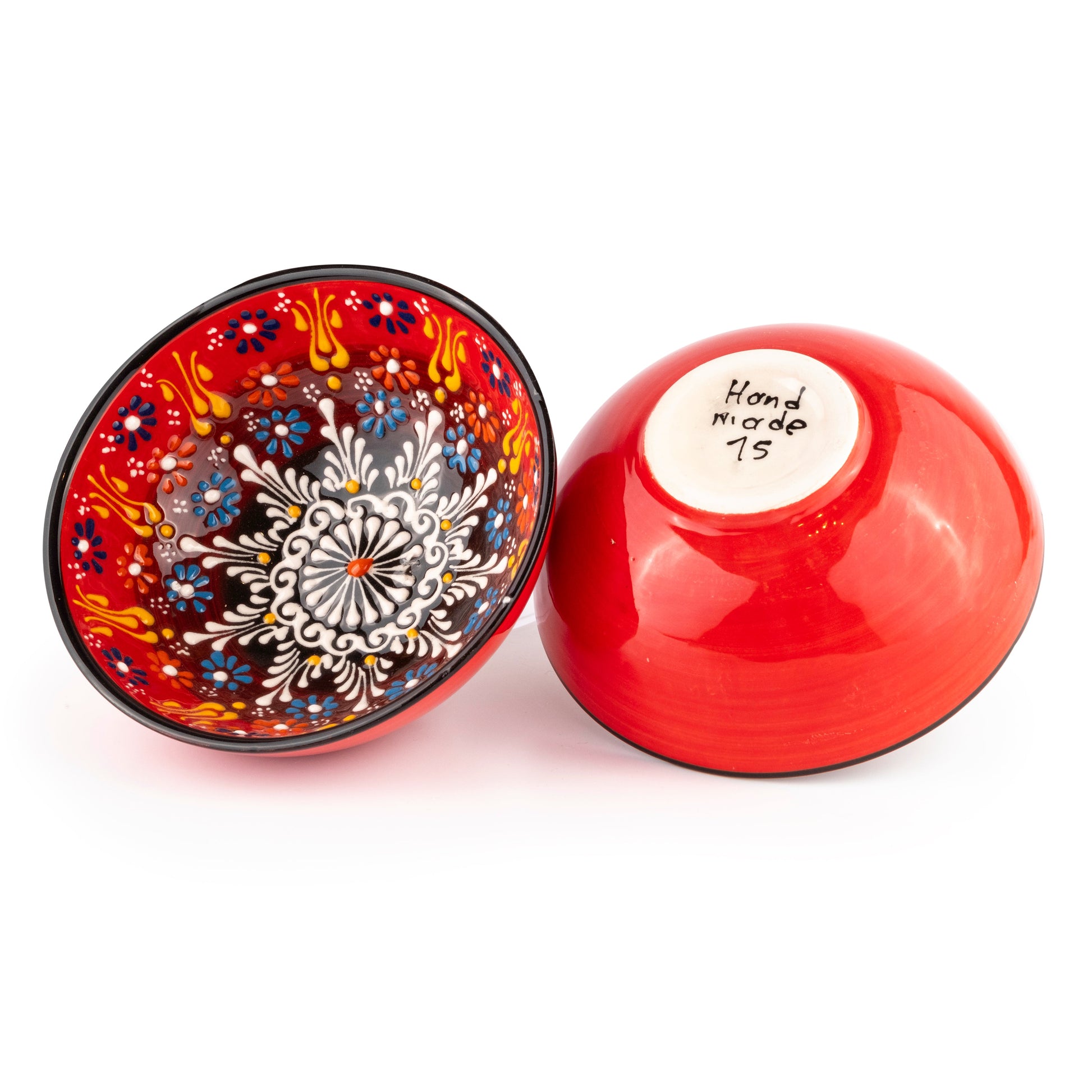 Ceramic serving bowl with decorative pattern on a white background