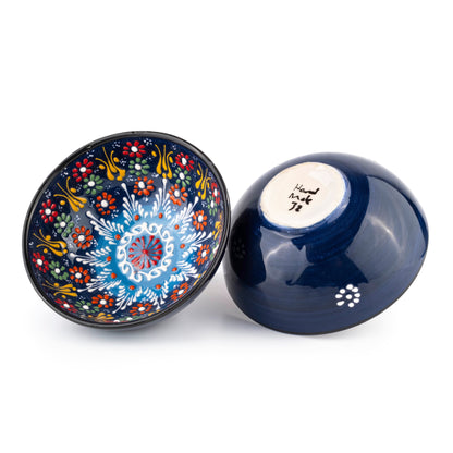 Decorative ceramic salad bowl with intricate patterns on a white background