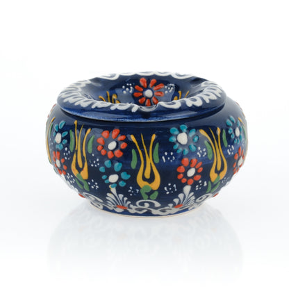 Decorative ceramic ashtray with floral patterns on a white background