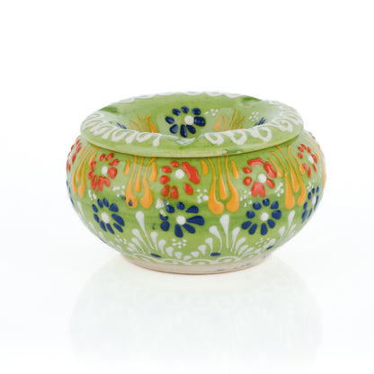 Decorative ceramic ashtray with colorful patterns on a white background