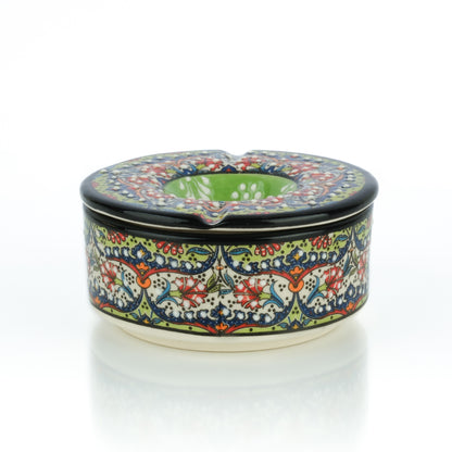 Decorative ceramic ashtray with floral pattern on a white background