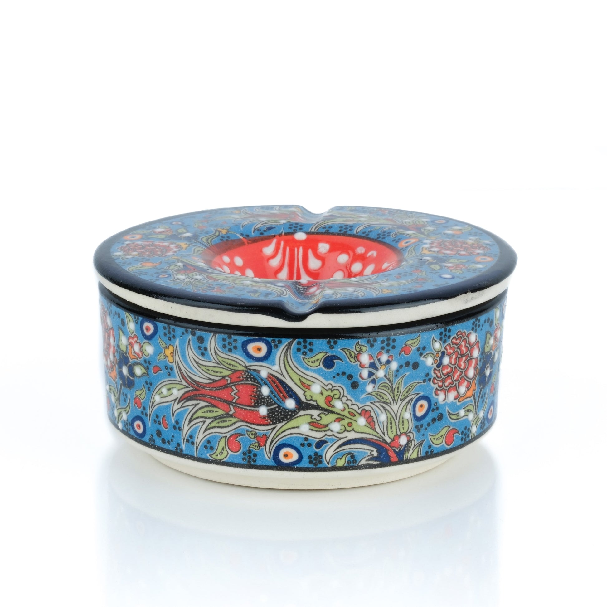 Decorative ceramic ashtray with floral patterns on a white background