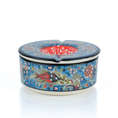 Decorative ceramic ashtray with floral patterns on a white background