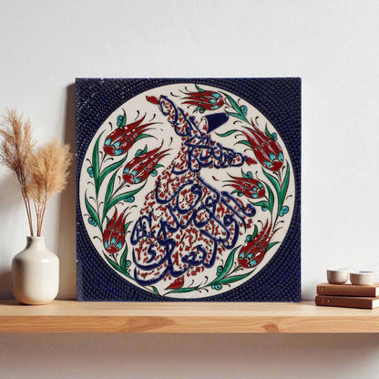 Decorative ceramic wall tile with intricate calligraphy and floral patterns on a shelf.