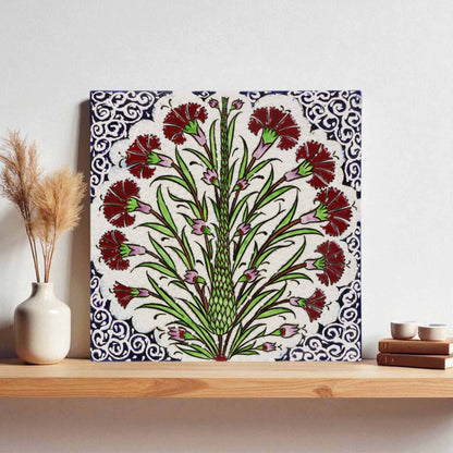 Decorative ceramic tile with floral design on a shelf