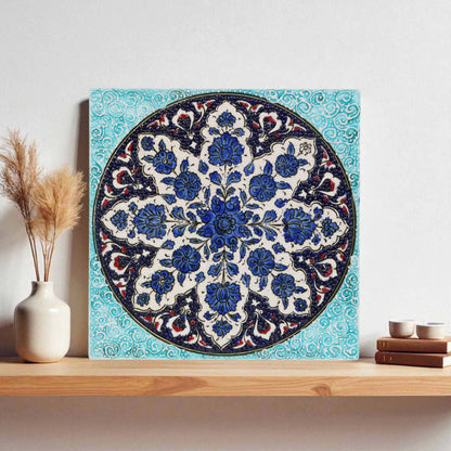 Decorative ceramic tile with floral pattern on a wooden shelf