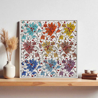 Framed floral ceramic tile on a wooden shelf with decorative items.