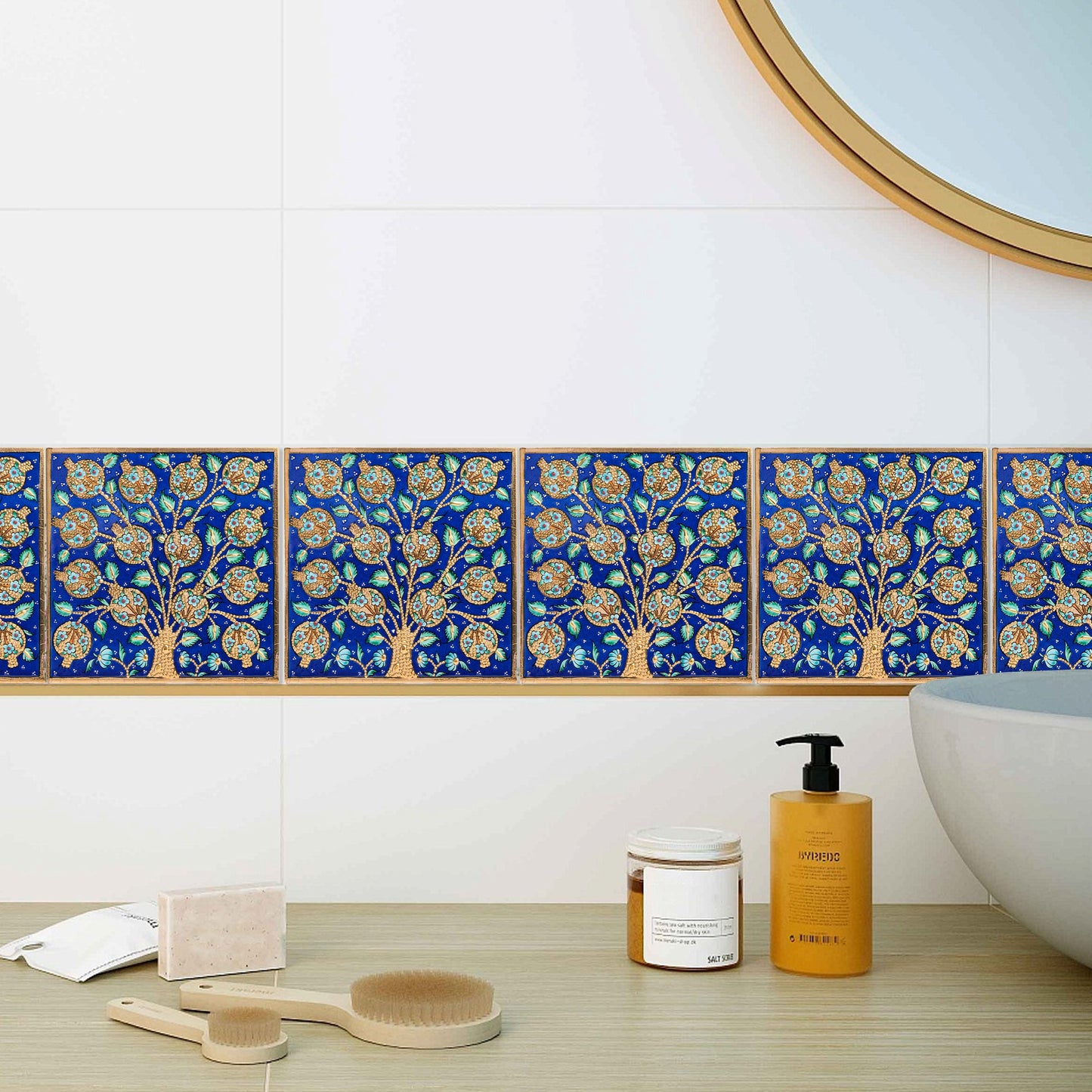 Decorative blue ceramic tiles with floral patterns above a bathtub.
