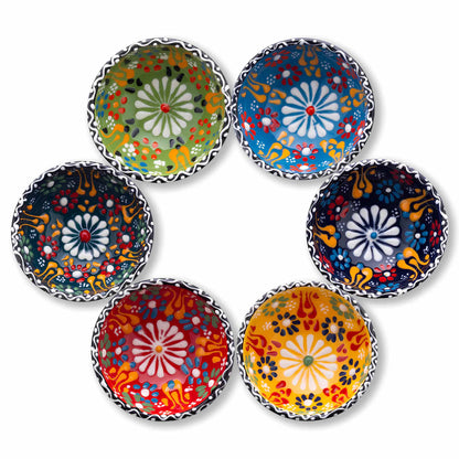 Set of six colorful ceramic dipping bowls with floral patterns on a white background