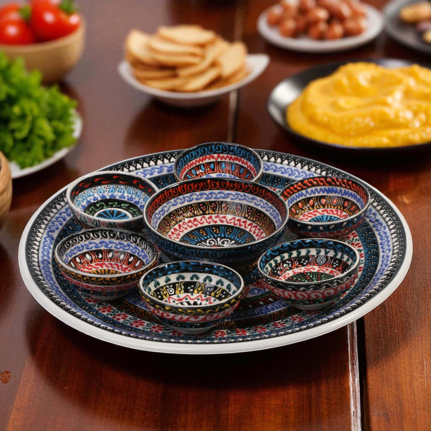 Decorative set of ceramic bowls with a colorful pattern on a wooden table.