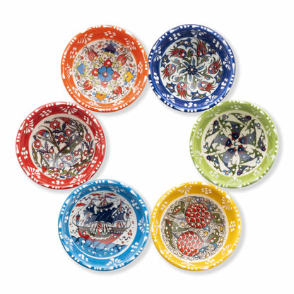 Set of six colorful ceramic dip bowls with intricate patterns on a white background