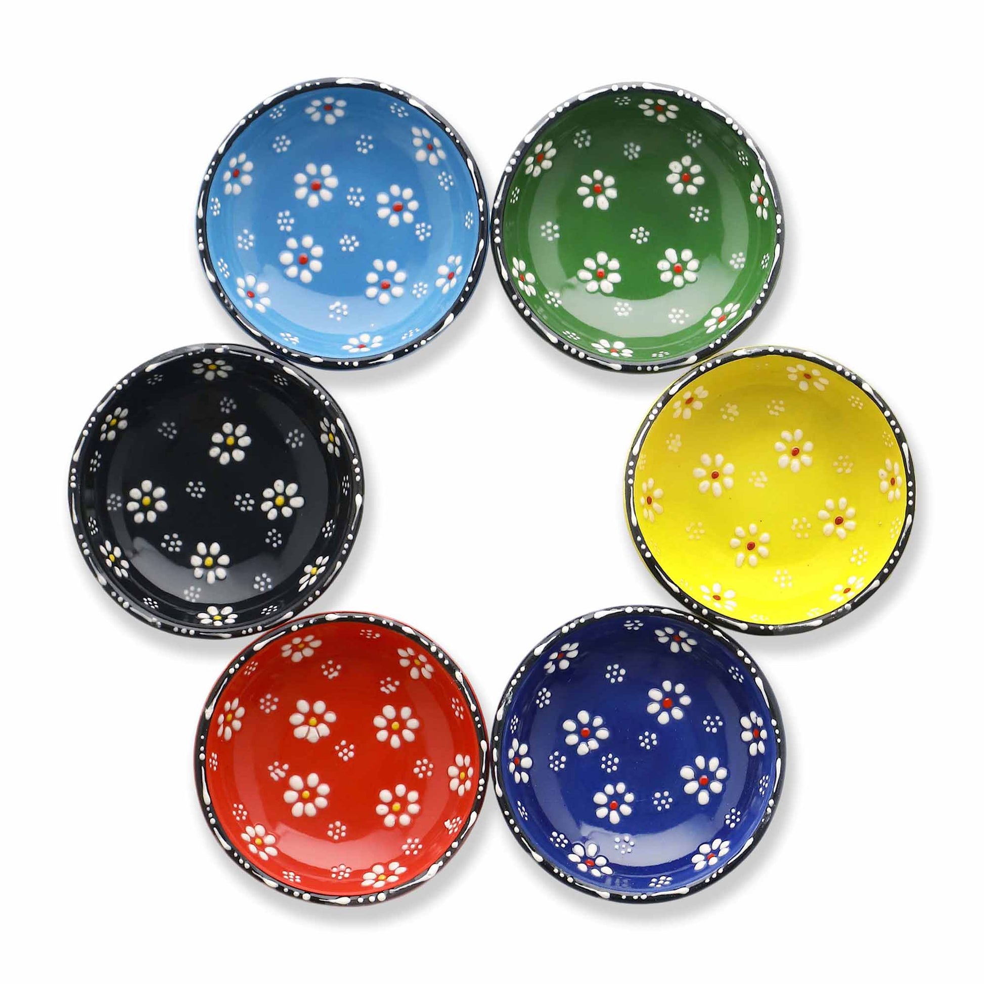 Set of six colorful ceramic bowls with floral patterns on a white background