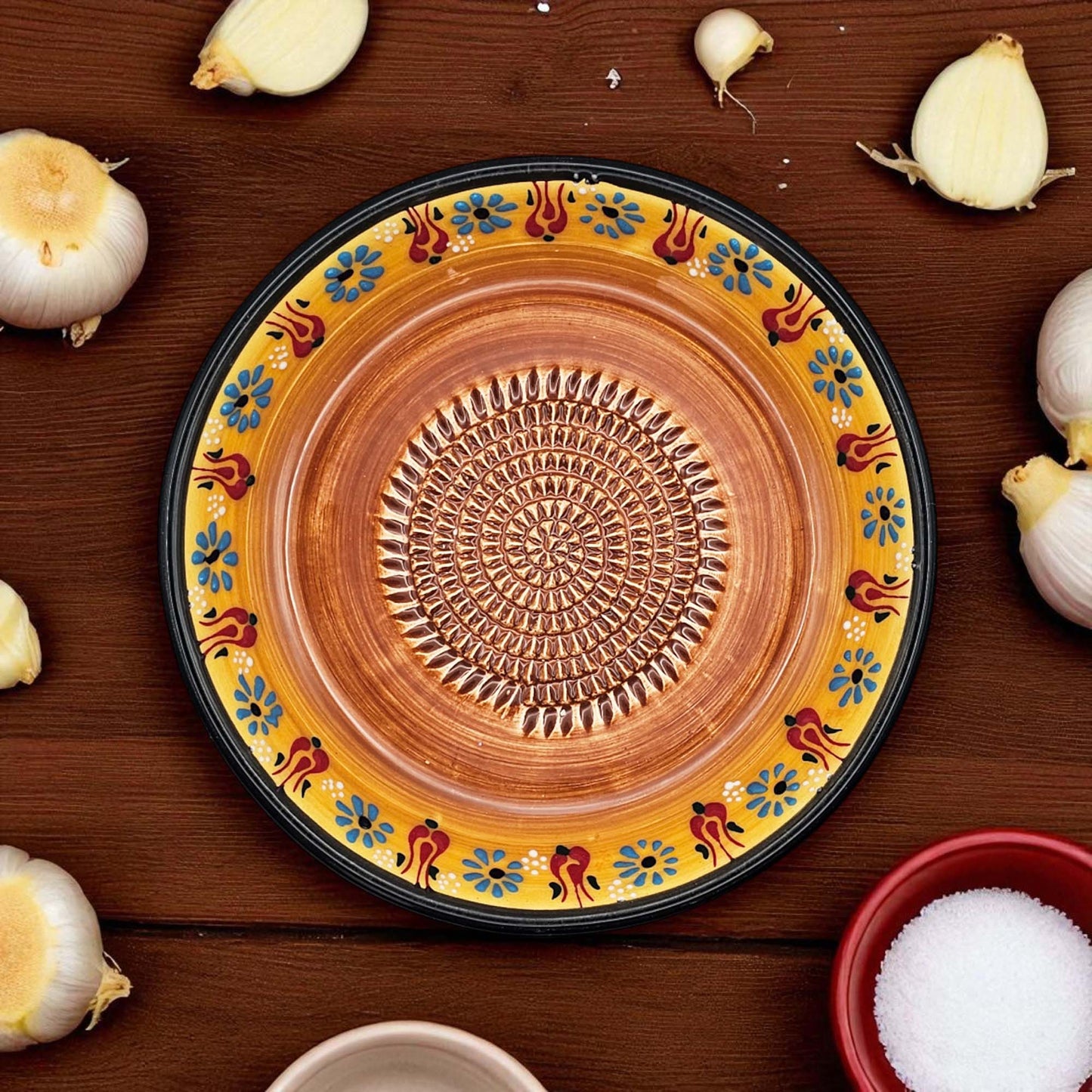 Handmade ceramic garlic grater bowl in Saffron Petals design. Large 7” size, perfect for garlic, ginger & spices. Bright artisan style, dishwasher safe.