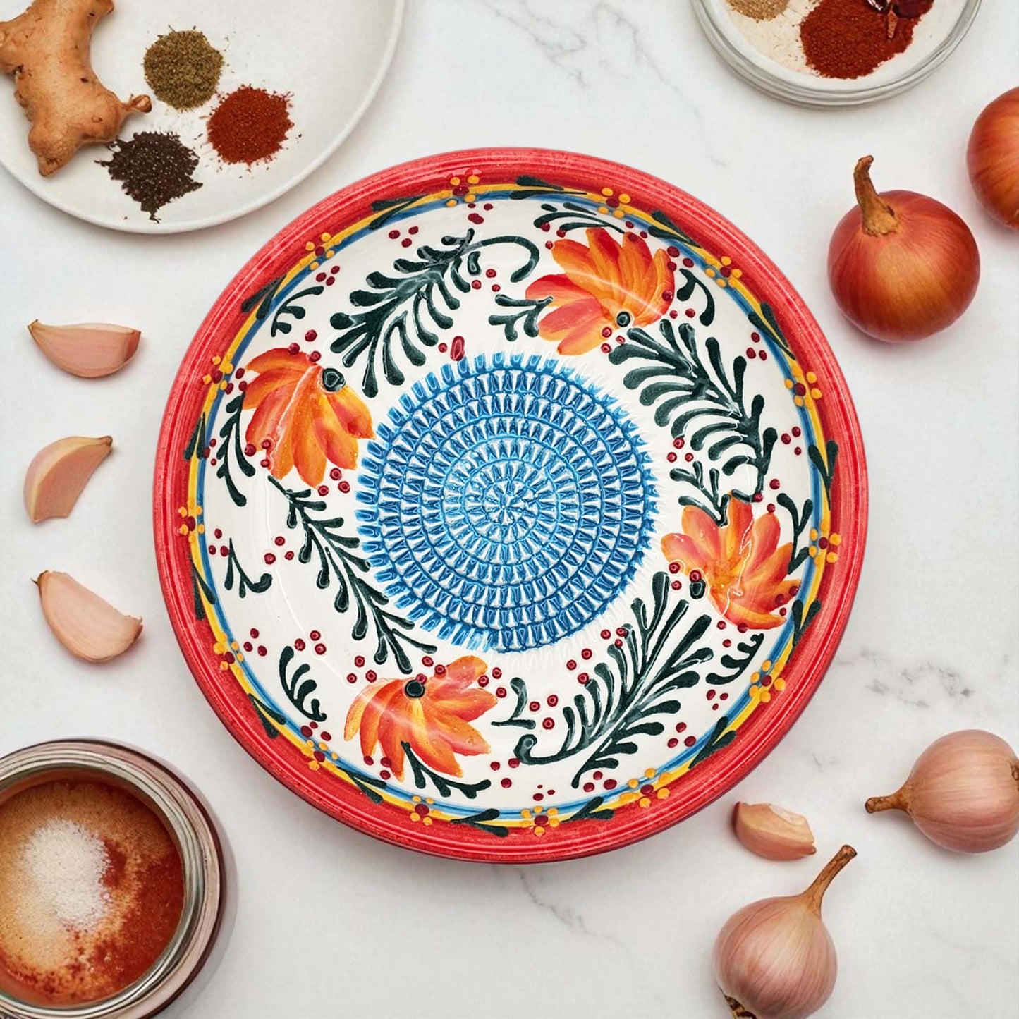 Handmade ceramic garlic grater bowl in Coral Garden design. Large 7” size, perfect for garlic, ginger & spices. Vibrant floral style, dishwasher safe.