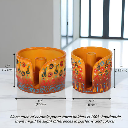 Two ceramic paper towel holders with floral designs and measurements on a white background.