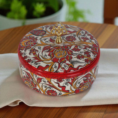 Decorative sugar bowl with intricate patterns on a wooden surface
