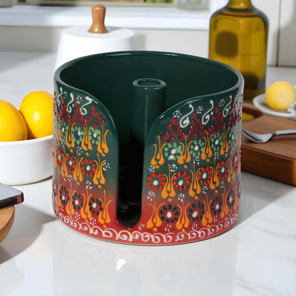Decorative paper towel holder with colorful patterns on a kitchen counter.