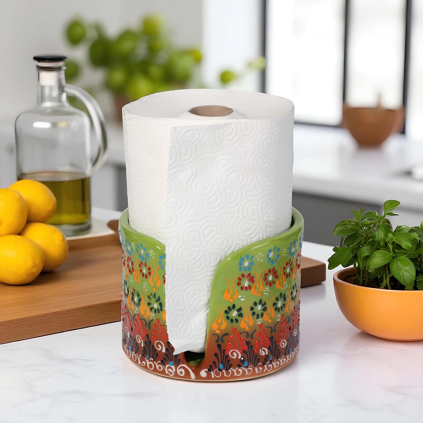 Decorative paper towel holder with a roll of paper towels on a kitchen counter.