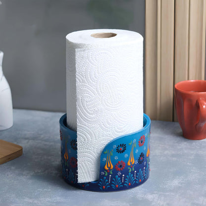 Roll of paper towels in a blue paper towel holder on a kitchen counter