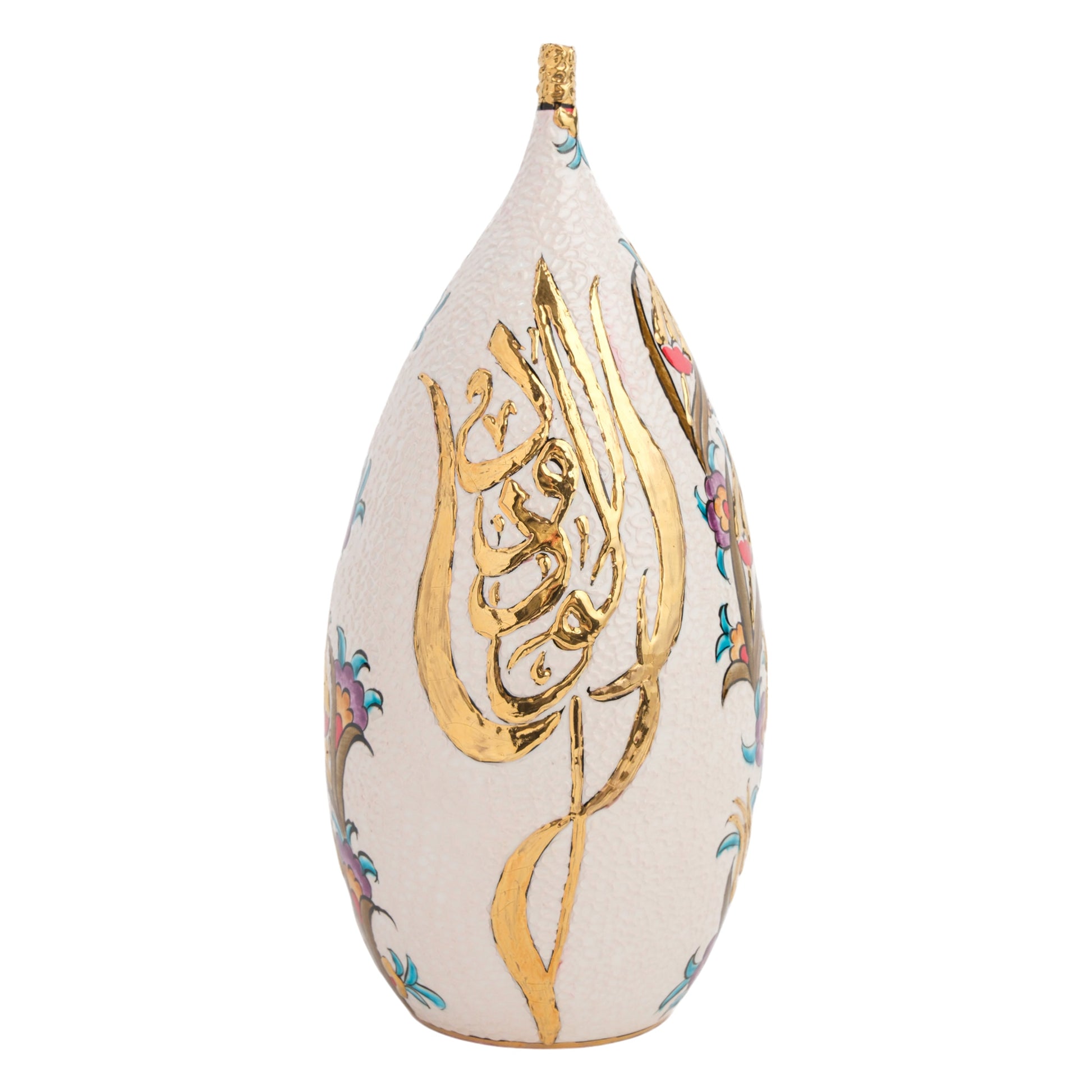 A handmade ceramic decorative bottle with hand-painted golden script on a textured white background.