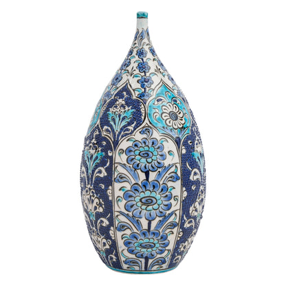 A hand-painted ceramic decorative bottle with blue and turquoise floral motifs against a white background.