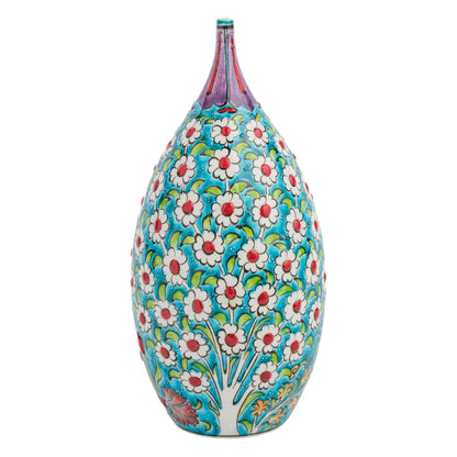 A hand-painted ceramic decorative bottle with a vibrant floral pattern in white, red, and green on a turquoise background, featuring a pointed top.