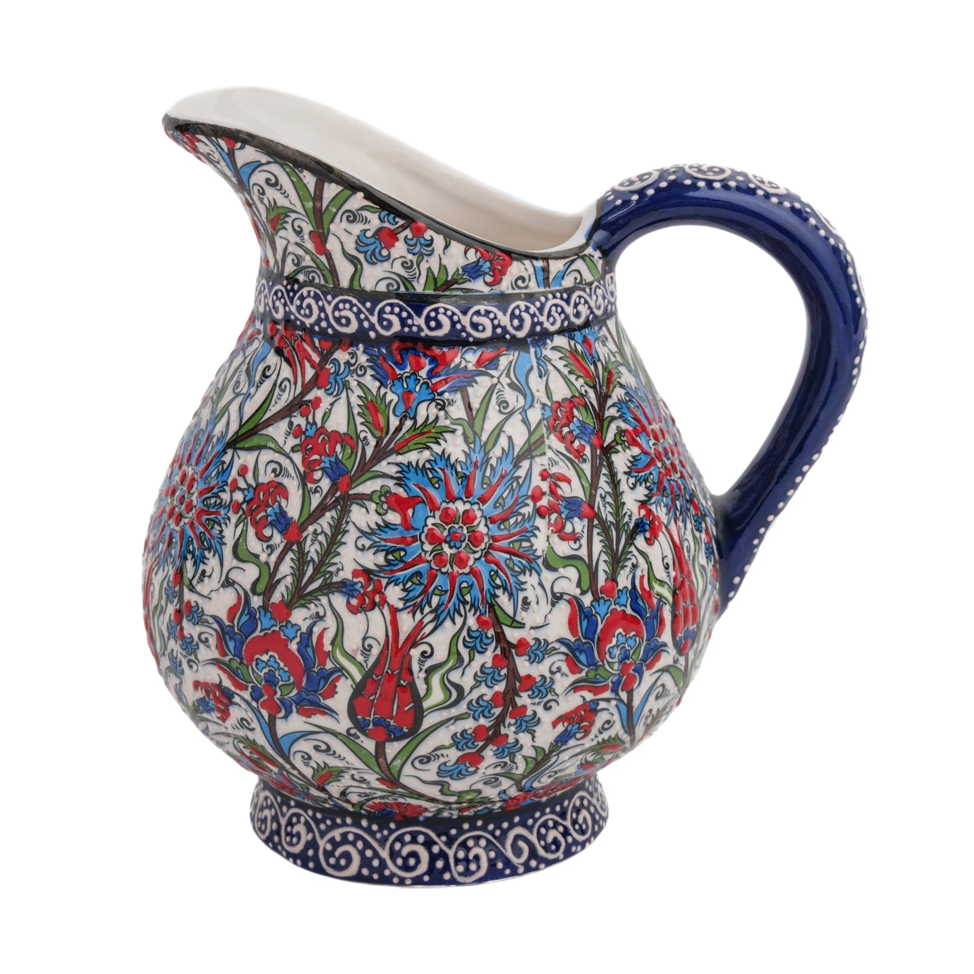 A hand-painted ceramic pitcher with a traditional floral design, featuring tulips and carnations in red, blue, and green colors on a white background.