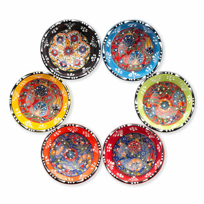 Set of six colorful ceramic bowls with floral patterns on a white background