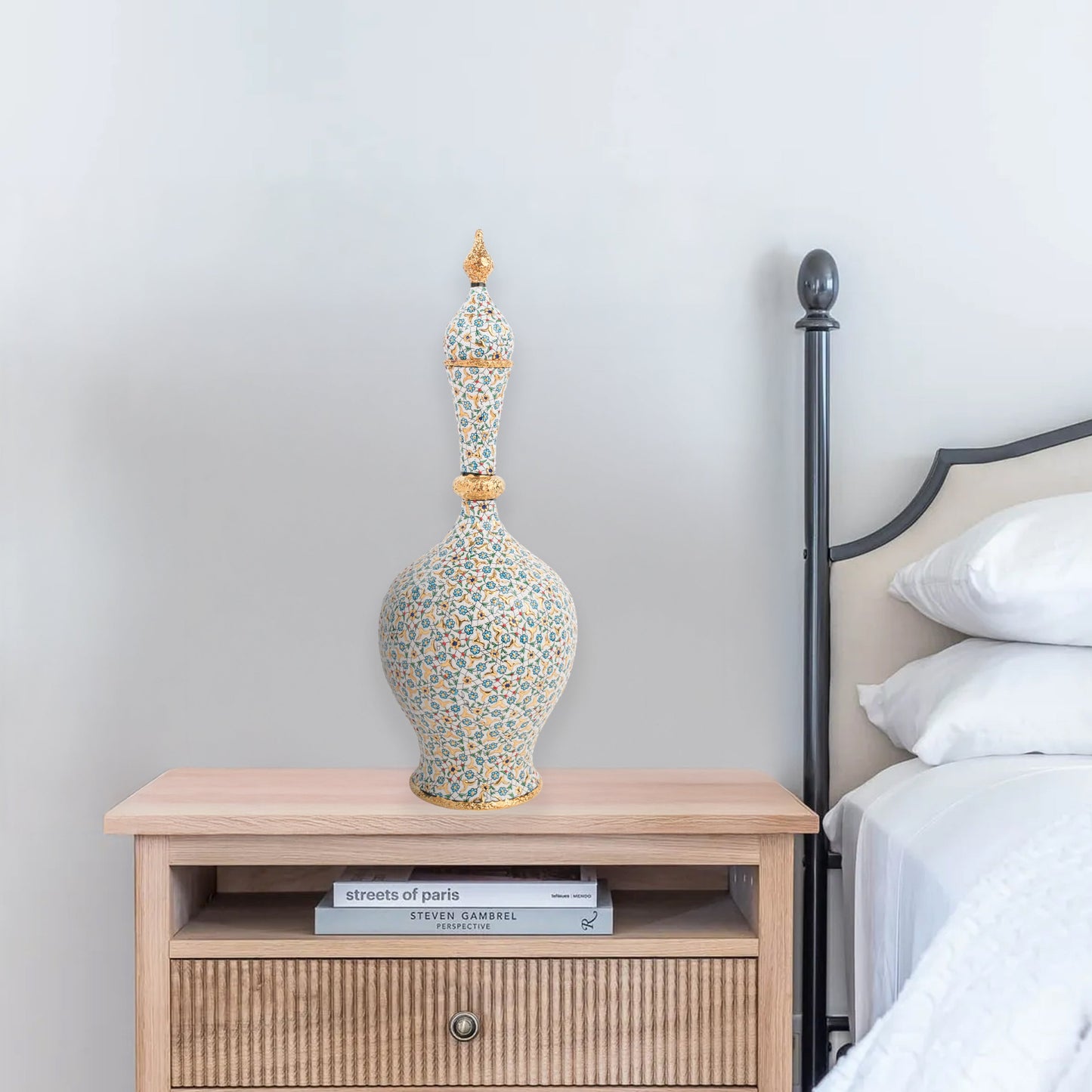 Hand-painted ceramic decorative bottle with turquoise floral motifs and golden details. Minaret-inspired shape with spire lid, perfect for décor or gifting.