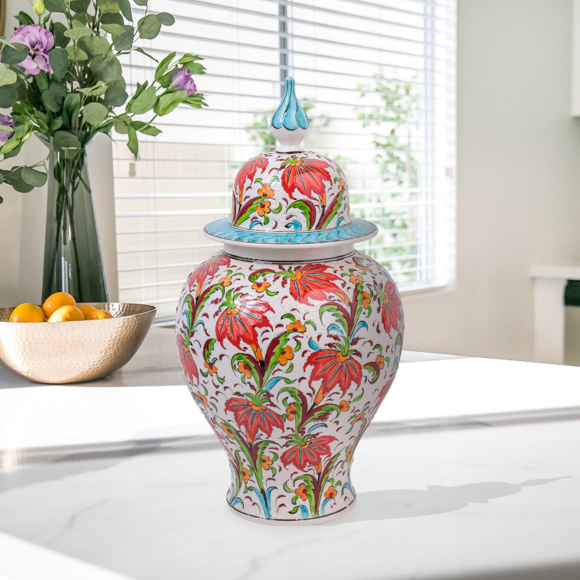 Hand-painted Tulip Garden ceramic jar with vivid red tulips, yellow blossoms & green foliage. Lidded artisan jar with turquoise finial, perfect décor or gift.