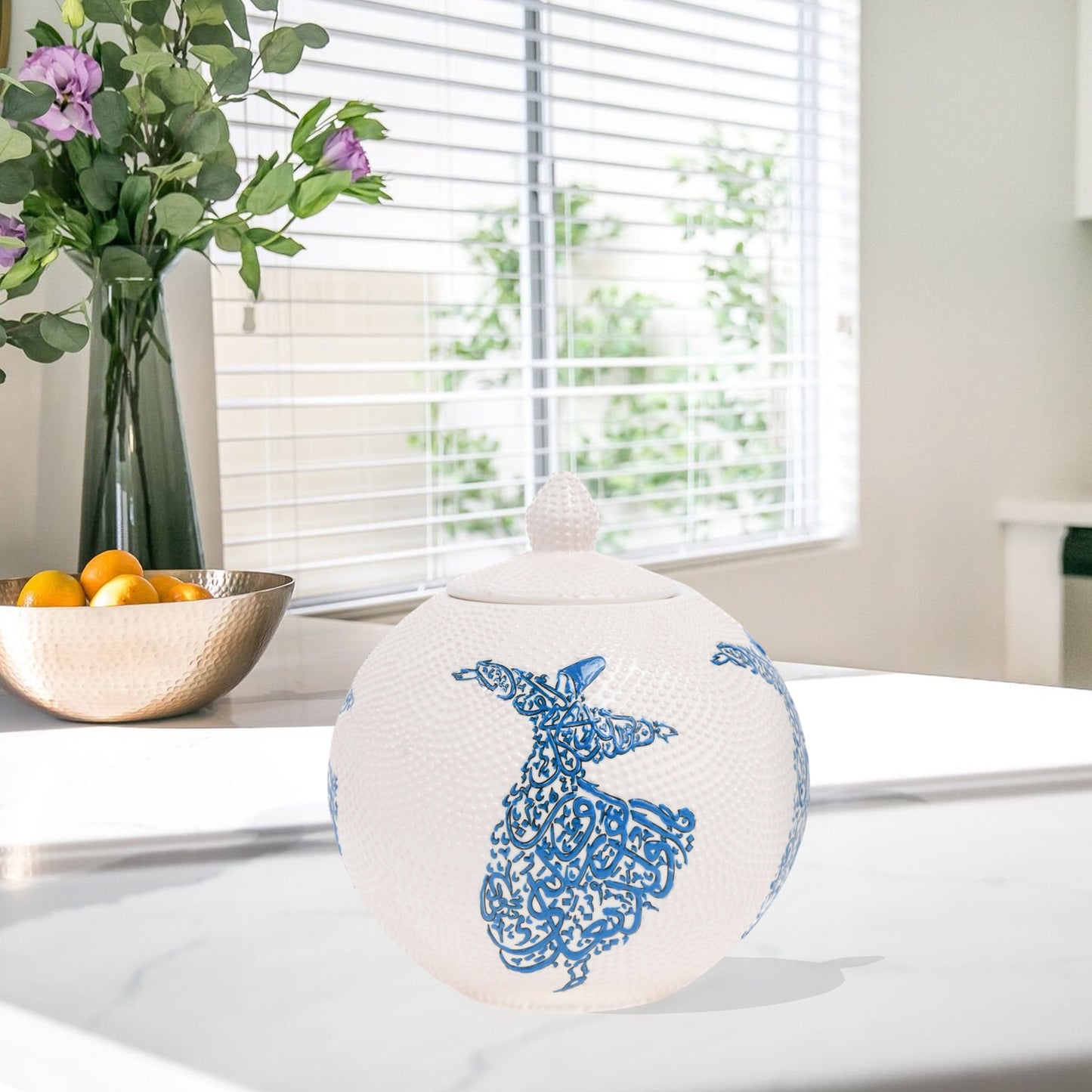 Hand-painted Whirling Dervish globe jar with Arabic calligraphy design. Available in blue or red, this ceramic round jar is perfect for spiritual décor or gifts.