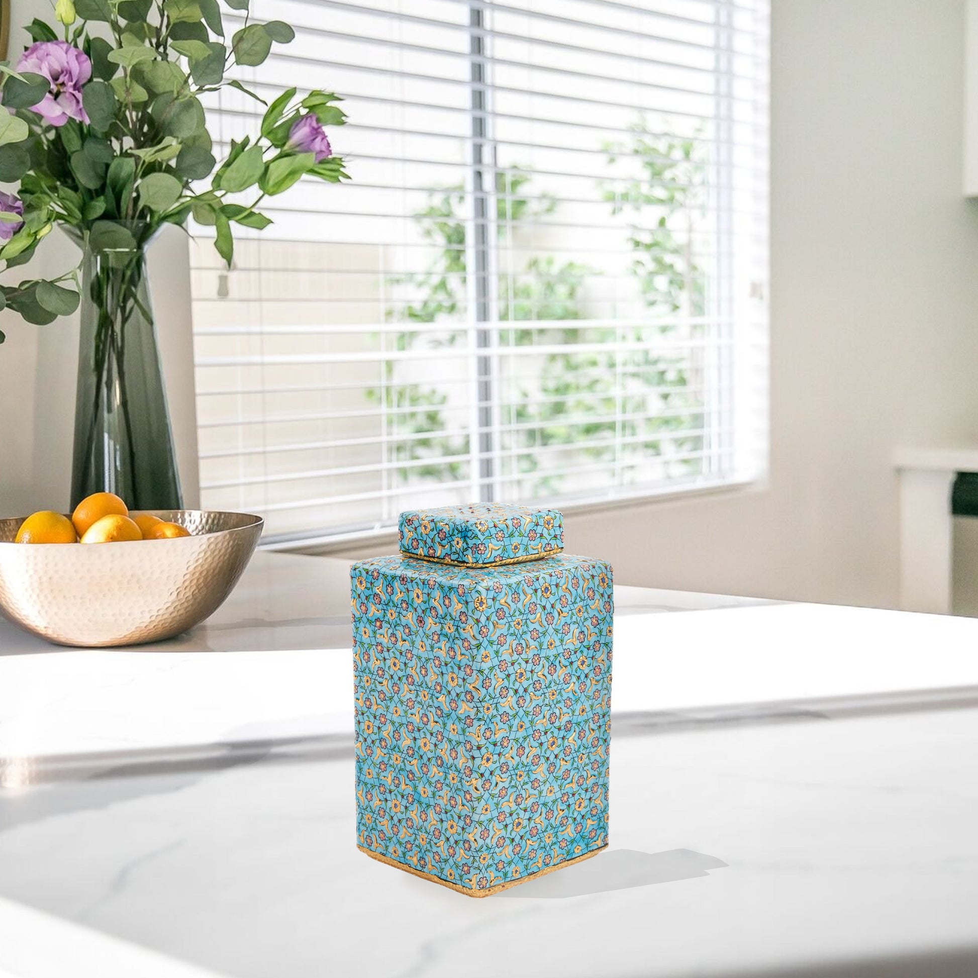 Hand-painted Golden Blossom ceramic jar with turquoise base and gold floral motifs. Square lidded design, artisan-made, perfect for décor, tea, or gifts.