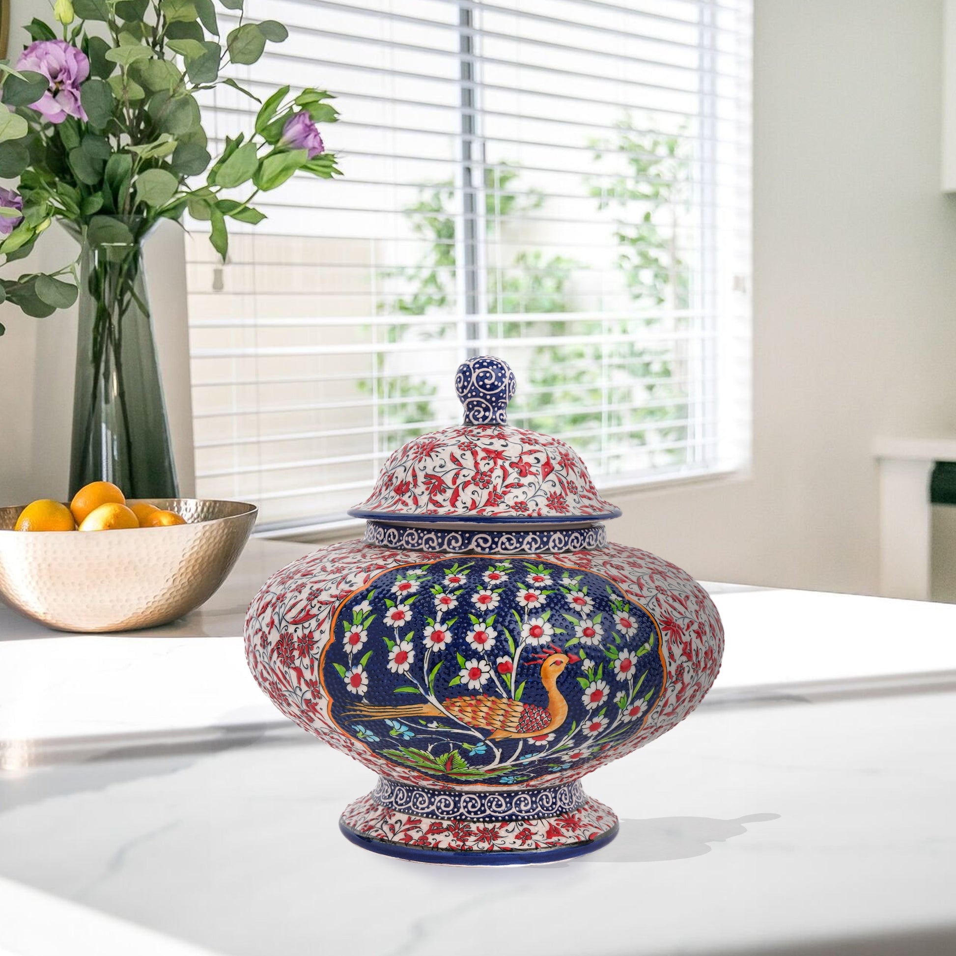 Hand-painted Songbird Bloom ceramic jar with bird and daisy motifs in navy, red & green. Wide artisan jar, glossy glazed, perfect décor accent or gift.