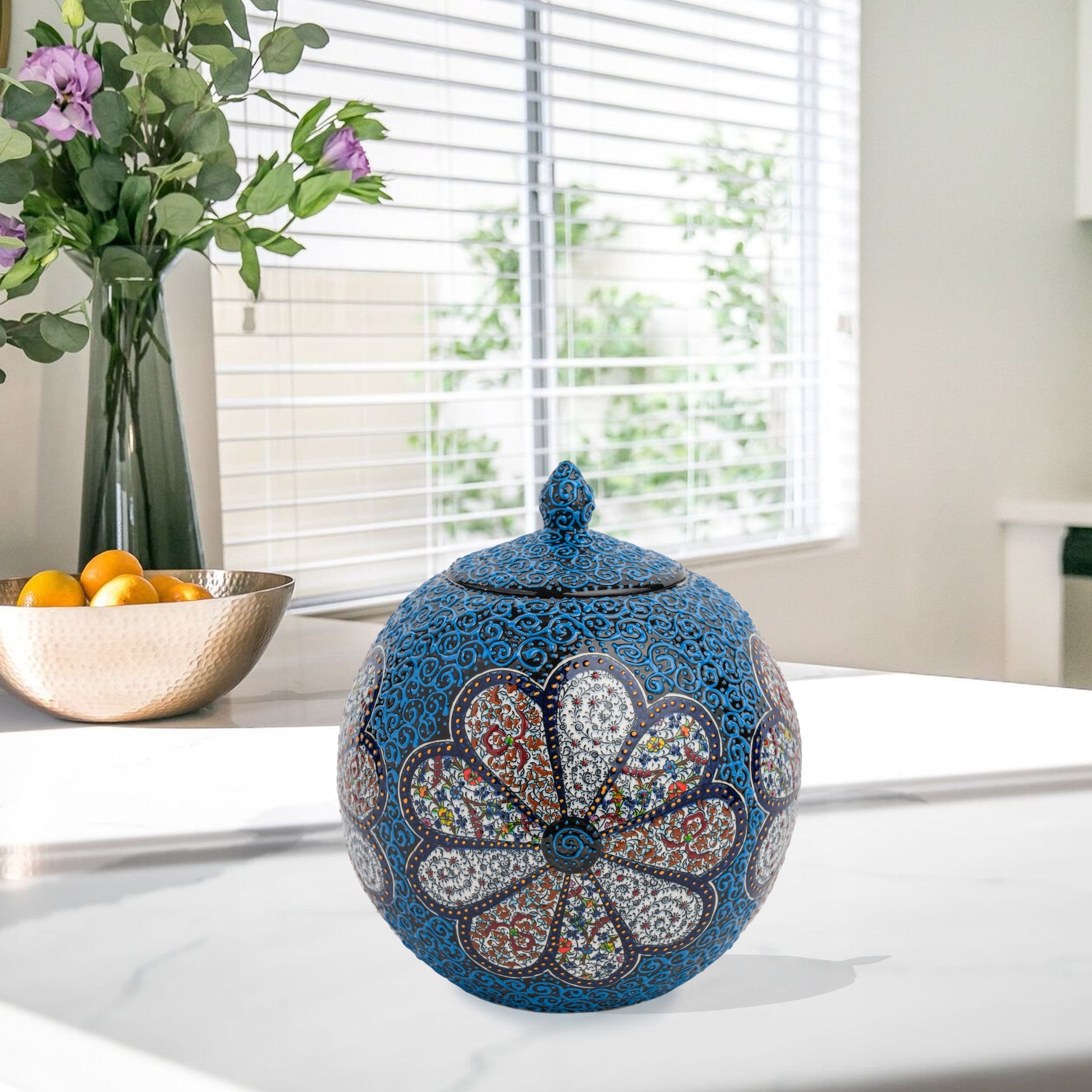Hand-painted Blue Blossom globe jar with layered floral motifs and raised blue scrollwork. Spherical ceramic jar, artisan-made, perfect décor or gift.