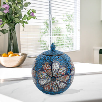 Hand-painted Blue Blossom globe jar with layered floral motifs and raised blue scrollwork. Spherical ceramic jar, artisan-made, perfect décor or gift.