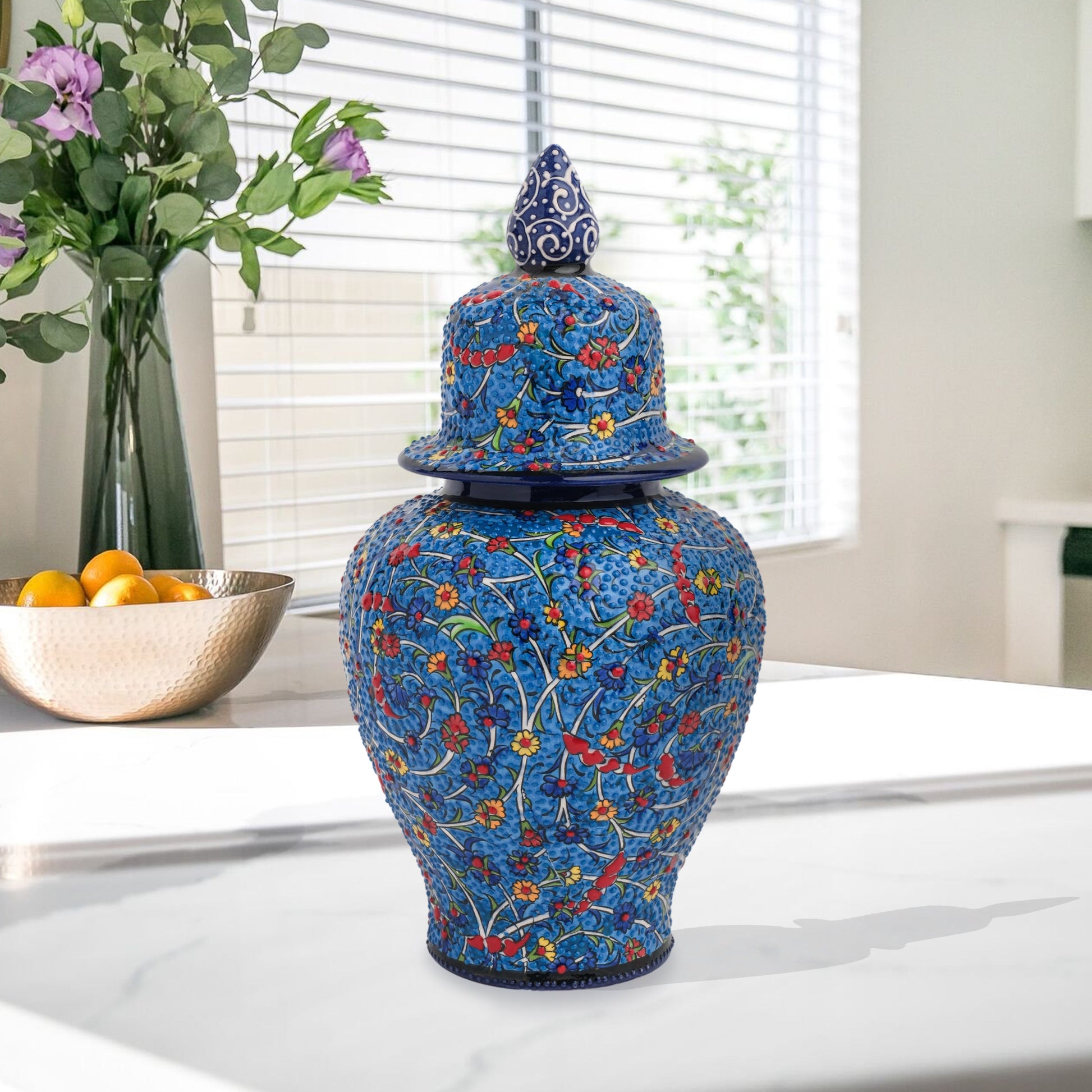 Hand-painted Blossom Night ceramic jar with vivid yellow, red & blue florals on cobalt base. Glossy artisan jar with ornate finial, perfect décor or gift.