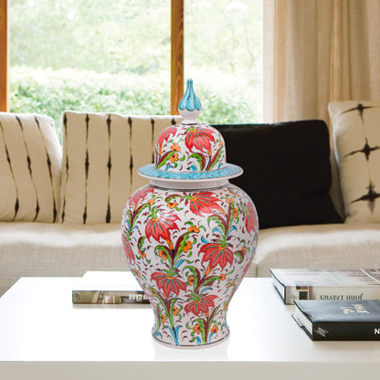 Hand-painted Tulip Garden ceramic jar with vivid red tulips, yellow blossoms & green foliage. Lidded artisan jar with turquoise finial, perfect décor or gift.