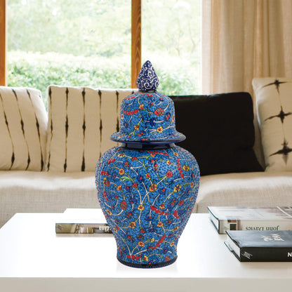 Hand-painted Blossom Night ceramic jar with vivid yellow, red & blue florals on cobalt base. Glossy artisan jar with ornate finial, perfect décor or gift.