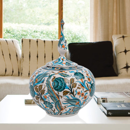 Hand-painted Iznik Bloom globe jar with teal blooms, tulips & vines on white. Bulbous Ottoman-inspired ceramic jar with finial lid, perfect décor or gift.