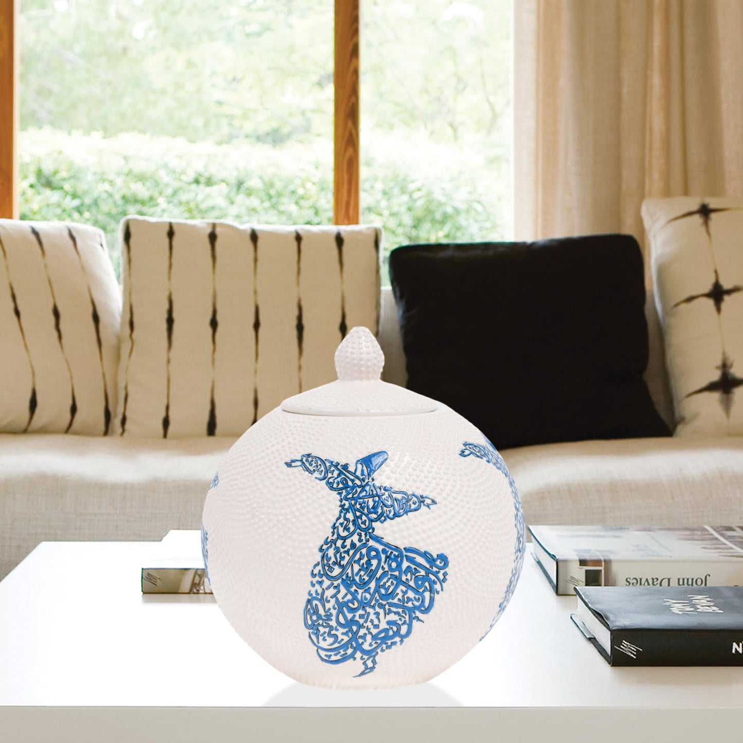 Hand-painted Whirling Dervish globe jar with Arabic calligraphy design. Available in blue or red, this ceramic round jar is perfect for spiritual décor or gifts.