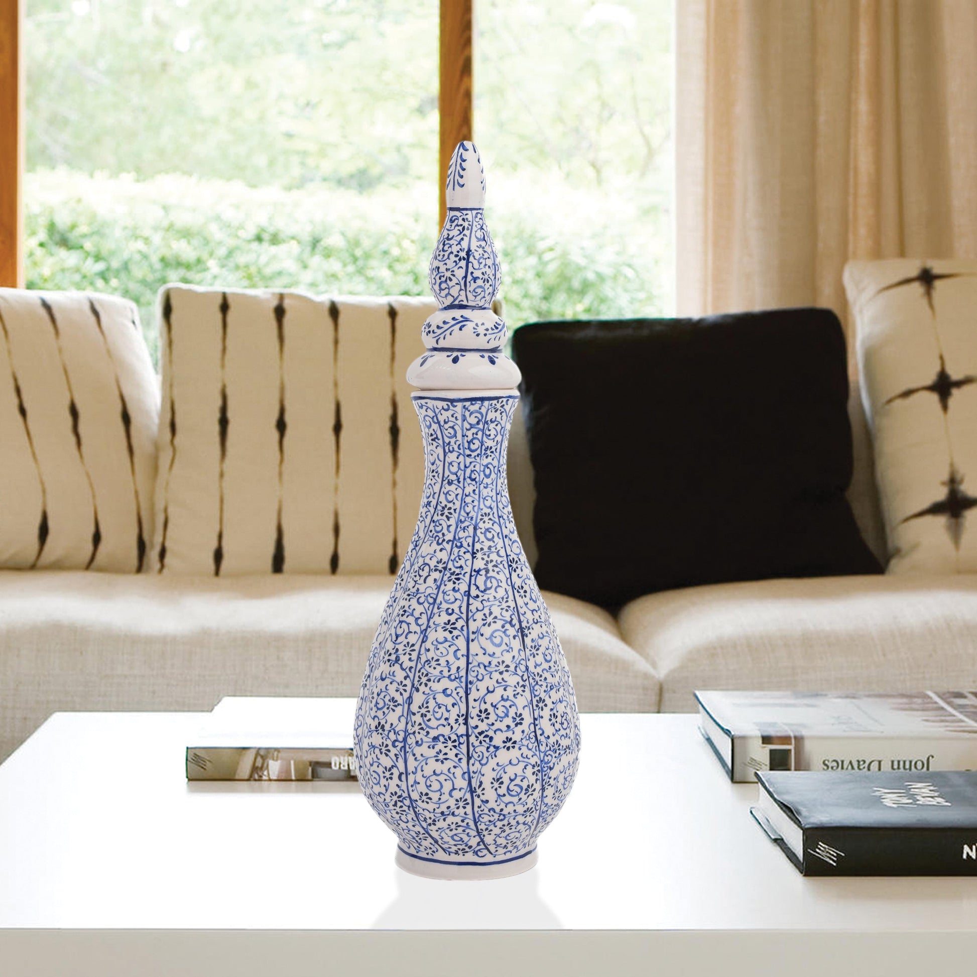 Hand-painted Iznik Nightingale’s Eye ceramic vase with lid, featuring blue vine motifs on white. Tall Ottoman-inspired design, perfect for décor or gifting.